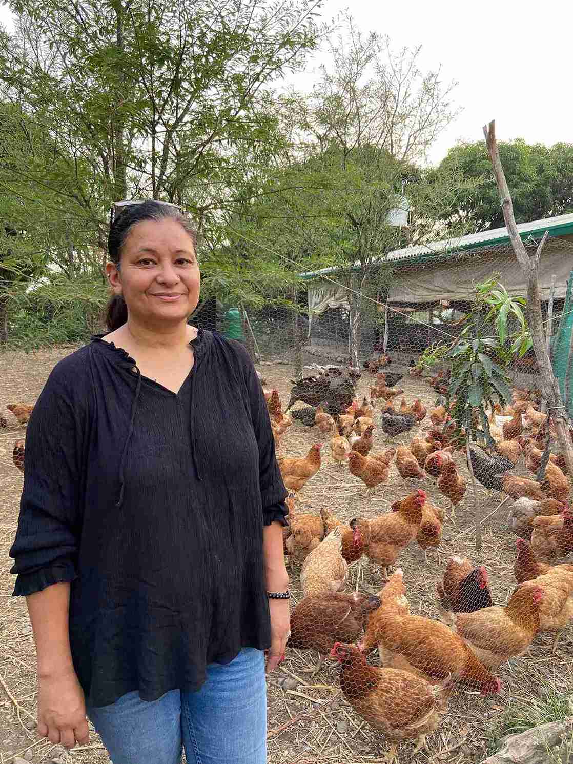 Namita at the poultry section of the farm.